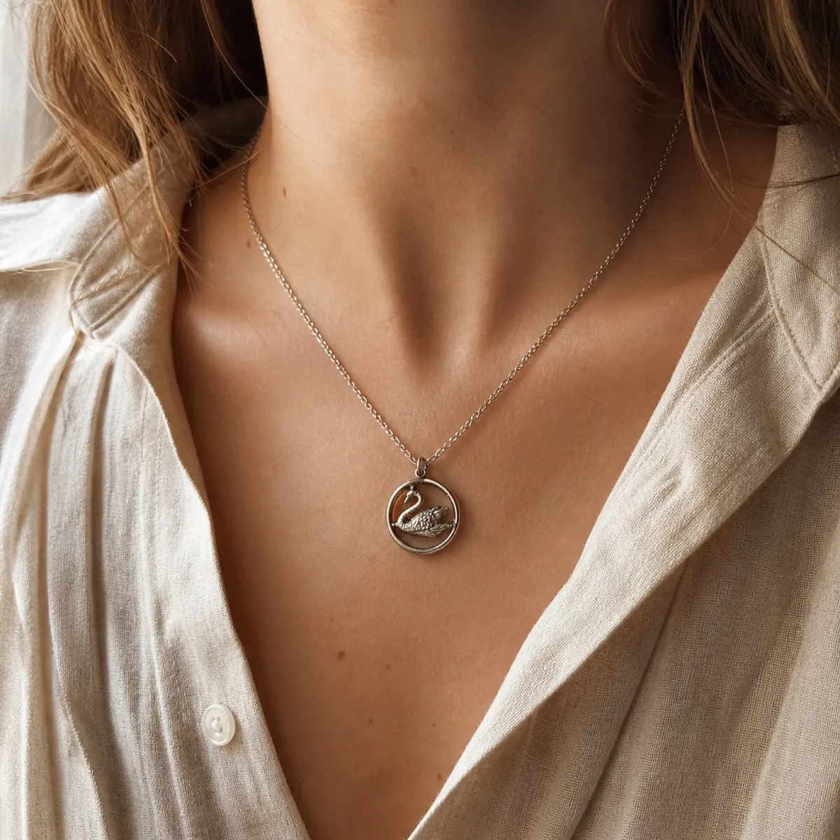 The Swan in the Circle silver pendant worn on a fine silver chain